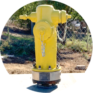 Water check valve on a yellow fire hydrant